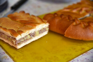 Meat delicious pie with potatoes close-up