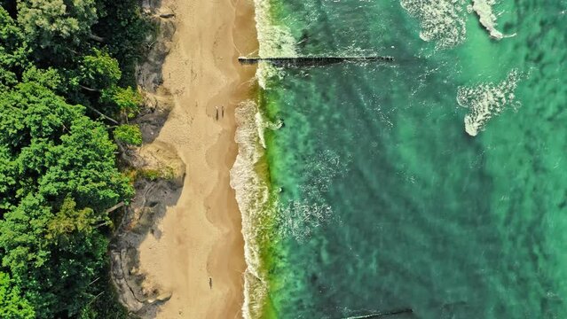 Waves on Batlic sea. Vacation at seaside. Aerial view, Poland.