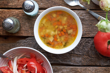 Chicken soup with potatoes and carrots.