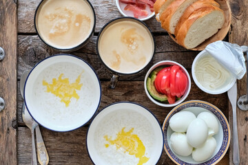 Breakfast. Coffee, milk rice porridge, boiled eggs, bread, tomatoes and avocado