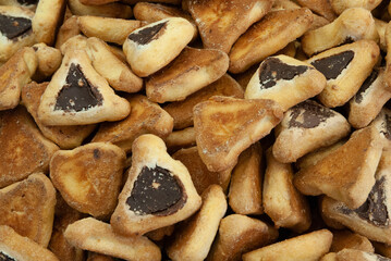 Traditional triangle-shaped cookies baked in celebration of the Jewish holiday of Purim. 