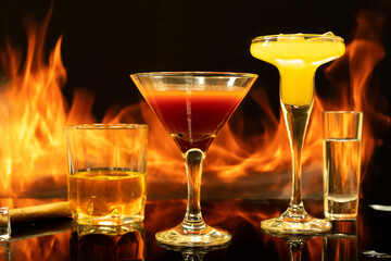 Drink on the background of fire flame, brands, vodka, cocktail, cognac, brandy