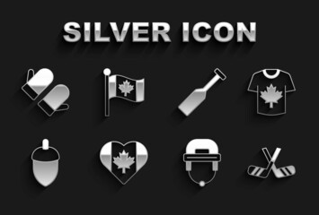 Set Heart shaped Canada flag, Hockey jersey, Ice hockey sticks, helmet, Acorn, Paddle, Christmas mitten and Flag of icon. Vector