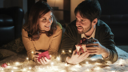 Young couple boy and girl on white carpet in Valentine's day