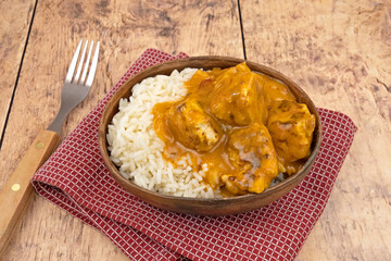 curry chicken dumpling with rice on a plate	