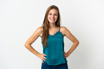 Young caucasian woman over isolated background posing with arms at hip and smiling