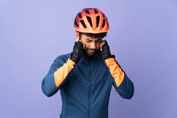 Young Moroccan cyclist man isolated on purple background frustrated and covering ears - obrazy, fototapety, plakaty