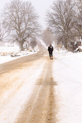 Fototapeta na wymiar man walking cold in snow