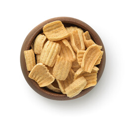 Top view of ruffled rye chips in wooden bowl