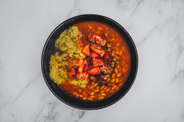 vegan baked beans and chickpea flour frittata with tomato salsa topping, healthy plant-based food
