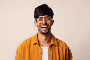 Closeup portrait of happy arabic guy smiling at camera