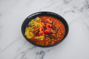 vegan baked beans and chickpea flour frittata with tomato salsa topping, healthy plant-based food