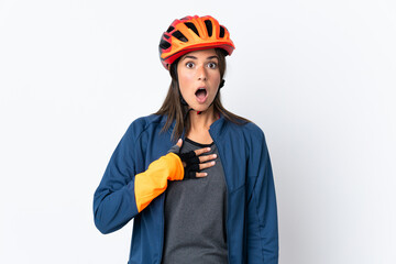 Young cyclist brazilian girl isolated on white  background surprised and shocked while looking right