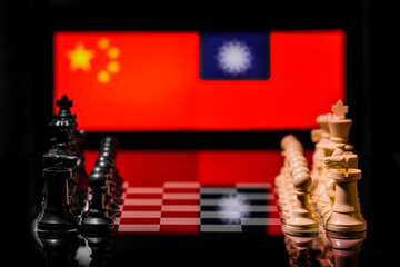 Conceptual image of war between China and Taiwan using chess pieces and national flags