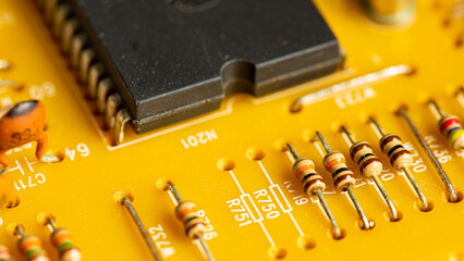 Close up of components and microchips on old PC circuit board.