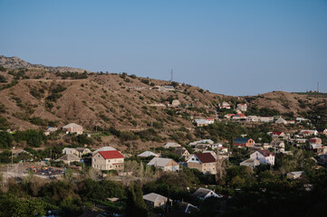 Fototapeta premium View of the resort village of Morskoye in Crimea on the Black Sea coast in summer