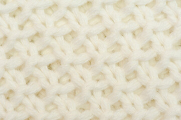 White background knitted texture. Repetitive machine Knitting sweater texture.
