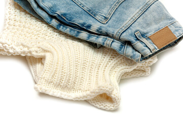 Sweater and jeans close-up on a white background.
Circular fashion,swap clothes idea,rent 