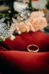 single wedding ring on a bouquet