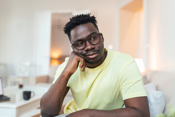 Close up profile view of pensive upset African American man look in distance thinking of personal problems, thoughtful sad biracial male feel depressed lost in thoughts pondering, having dilemma