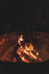 Camp fire snow winter campfire song playing campfire games and eating camp fire grill, telling campfire stories near the fire with wood, flames in the nature at night