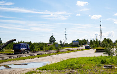 Repair of the road in the center of the city of Noyabrsk on Yamal in summer
