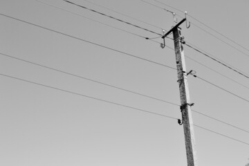 Power electric pole with line wire on background close up