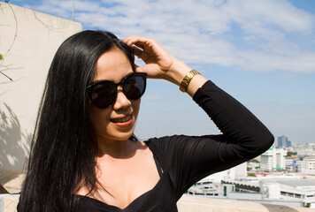 Young asian woman smiling happy on the city background