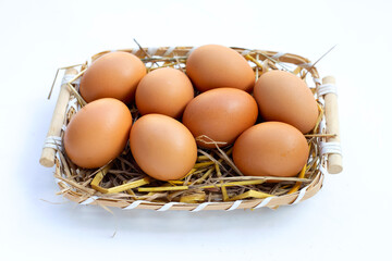 Fresh organic eggs in a straw nest