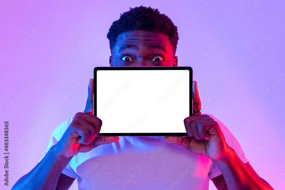 Poster tablet screen mockup. cool black man covering face with blank touch pad, recommending new app or web