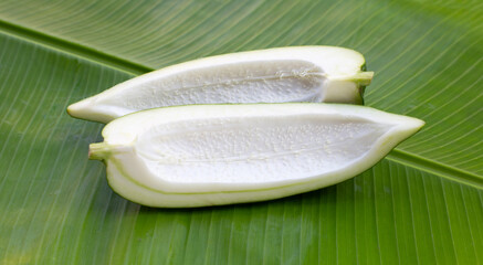 Green papaya on banana leaf