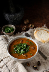 Soup kharcho, a traditional dish of Georgian cuisine. The background is light, vertical orientation, top view.