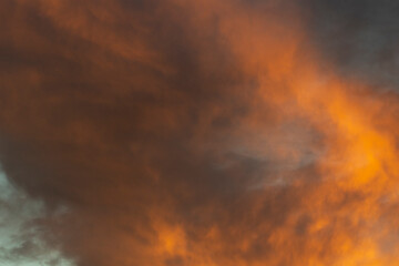 Fototapeta na wymiar Fiery clouds. Sunset light. Orange sky. Landscape sunset colors.