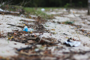 Beach pollution. Plastic bottles and other trash on sea beach. Ecological concept. earth day concept.globe pollution. Garbage on beach. Plastic at the ocean.