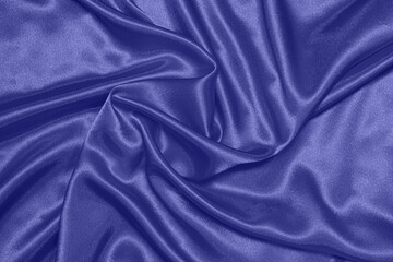Texture of satin fabric in the color of the year 2022 very peri, top view
