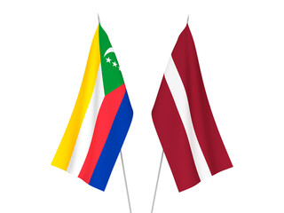 National fabric flags of Latvia and Union of the Comoros isolated on white background. 3d rendering illustration.