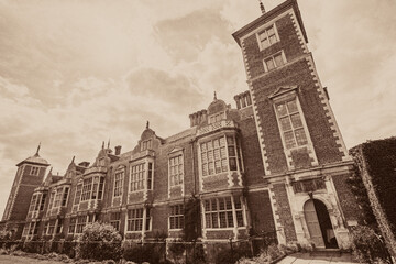 History of Architecture. Vintage toned typical historic English manor house.