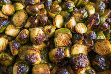 oven baked sliced brussels sprouts on baking tray closeup