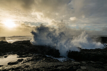 Fototapeta na wymiar Ocean scenery with strong waves while sunset at the raw coast of Rekjanes peninsula, Iceland