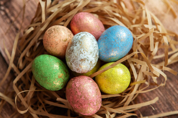 Colorful easter eggs on wooden background. . Happy Easter background.