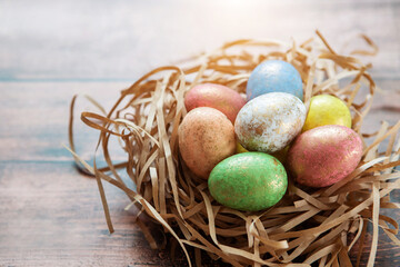 Colorful easter eggs on wooden background. . Happy Easter background.