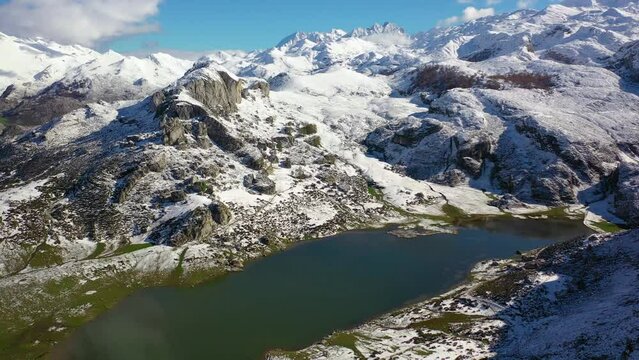 Lakes of Covadonga in Asturias with snowy mountains