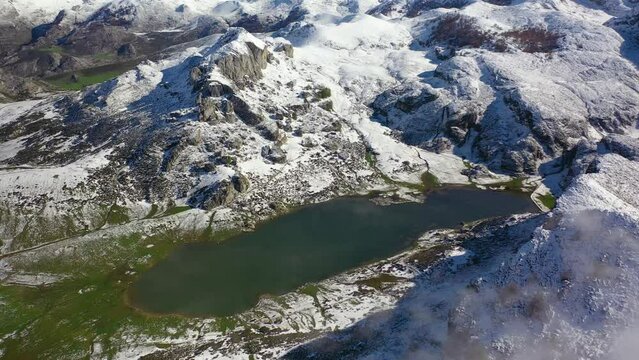 Lakes of Covadonga in Asturias with snowy mountains