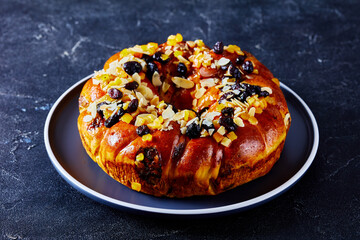 sweet bread wreath sprinkled with fruits and nuts