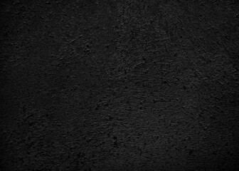 Black color wall background cement paper texture. Wallpaper surface for design art work and interior or exterior. High quality abstract pattern can be used as winter season Christmas card backdrop.