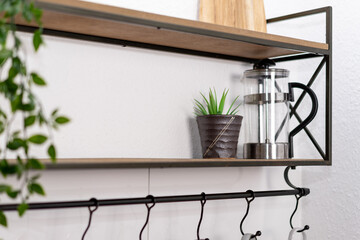 Close-up metal kitchen shelf for product display installation.