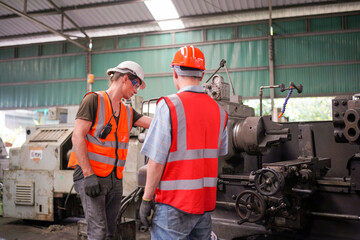 Industrial Engineers in Hard Hats.Work at the Heavy Industry Manufacturing Factory.industrial worker indoors in factory. man working in an industrial factory.