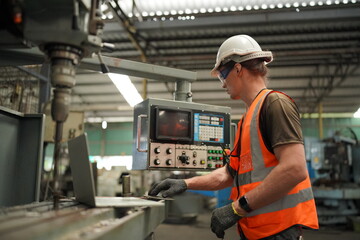 Industrial Engineers in Hard Hats.Work at the Heavy Industry Manufacturing Factory.industrial worker indoors in factory. man working in an industrial factory.