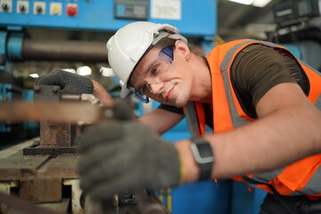 Industrial Engineers in Hard Hats.Work at the Heavy Industry Manufacturing Factory.industrial worker indoors in factory. man working in an industrial factory.