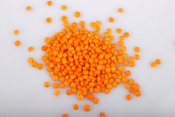 Red lentil isolated on white background.